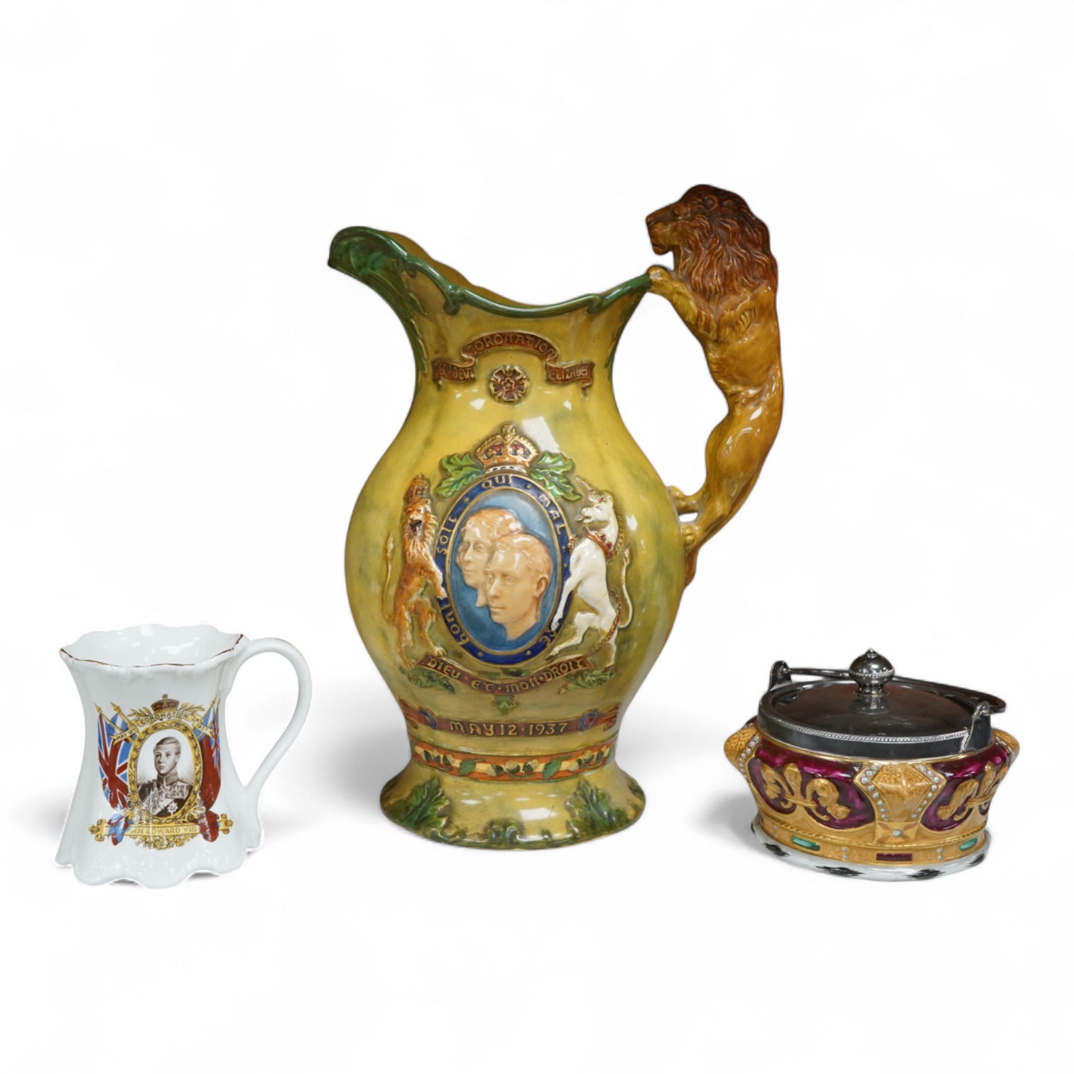 A Crown Devon George VI musical coronation jug, a crown shaped jar with plated cover and a coronation cup, largest 32cm high
